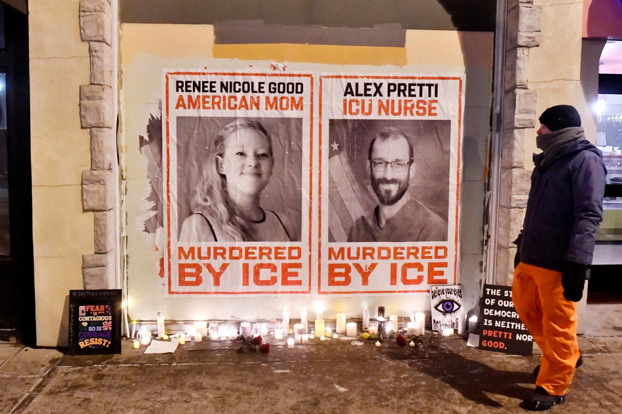 Posters of Renee Nicole Good and Alex Pretti, both US citizens fatally shot by immigration agents earlier this month, are seen during a candlelight vigil where 37-year-old Alex Pretti was last week, in Minneapolis, Minnesota, on Jan. 28, 2026. (AFP Photo)