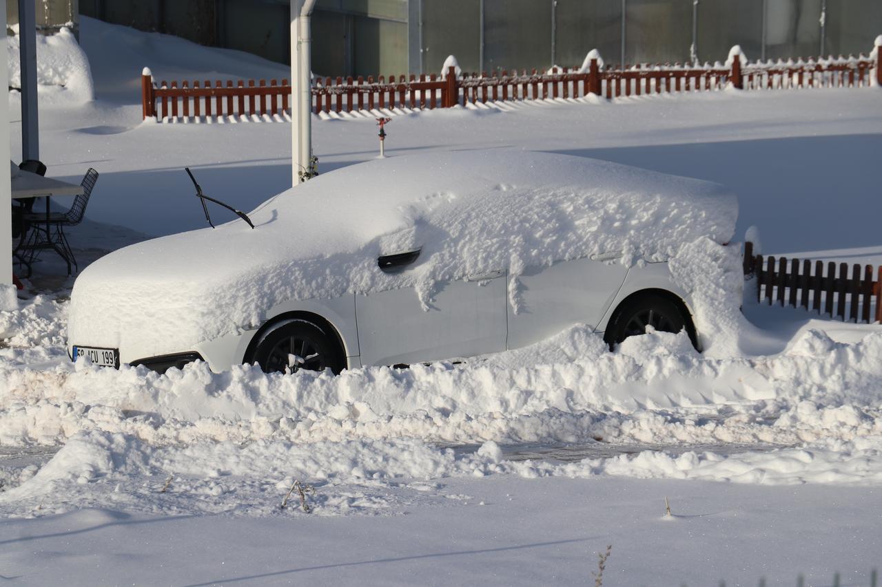 A view of a snow covered vehicle after snowfall in Sivas, Türkiye on Jan. 2, 2026. (AA Photo)