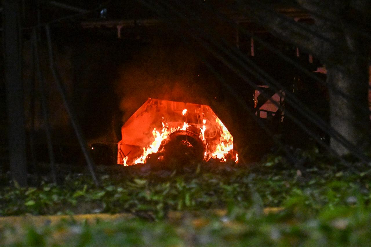 A vehicle burns at La Carlota air base in Caracas after a series of explosions on January 3, 2026. (AFP Photo)