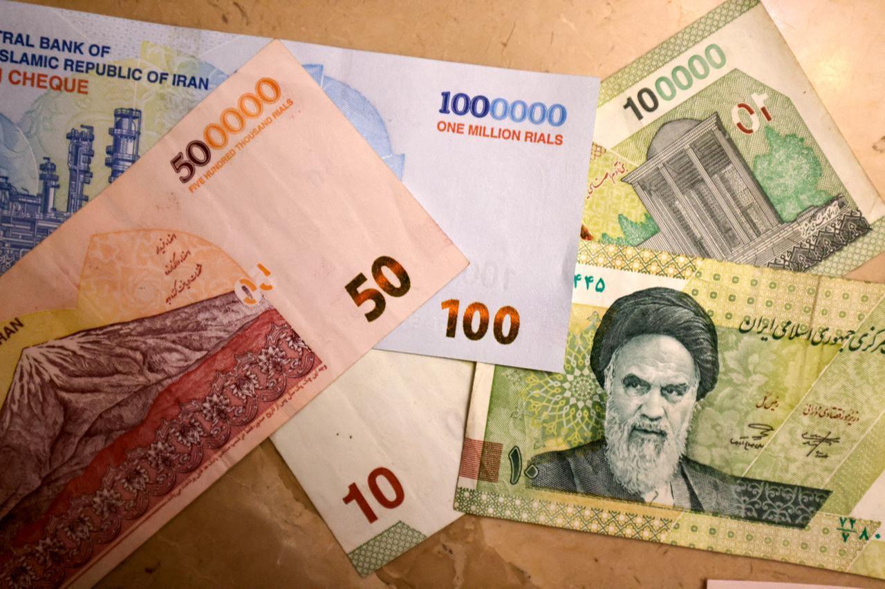 Photo shows new Iranian bank notes of one million, 500,000, and 100,000 rials on August 3, 2025. (AFP Photo)