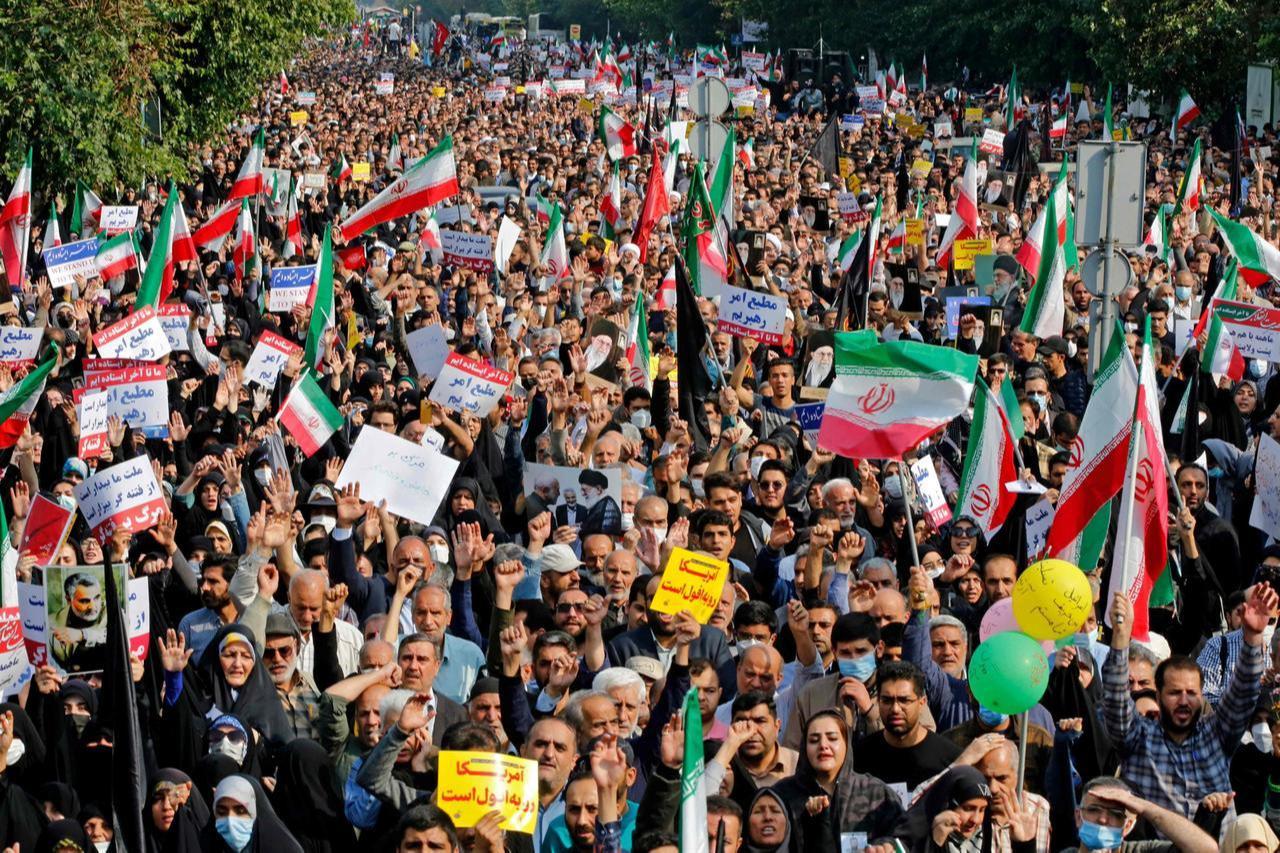 Iranians rally in support of the victims of the Shah Cheragh mausoleum and to denounce demonstrations sparked by the death of Mahsa Amini, in the capital Tehran, Iran, Oct. 28, 2022. (AFP Photo)