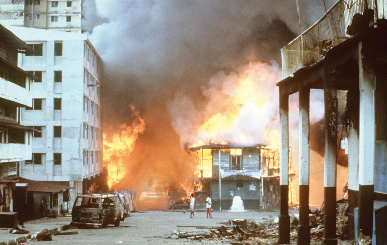 Buildings engulfed in flames following the US invasion of Panama, December 1989. (Photo via National Archives, Washington, DC)
