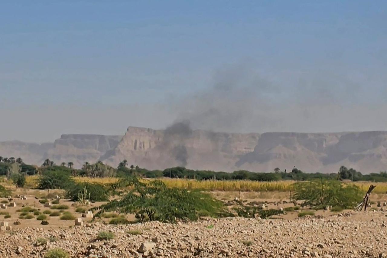 This image grab from an AFPTV footage shows smoke billowing after airstrikes that killed seven people in Yemen as a Saudi-led coalition hit back against a sweeping advance by the UAE-backed Southern Transition Council (STC) that threatens to spiral into a major confrontation. (AFP Photo)