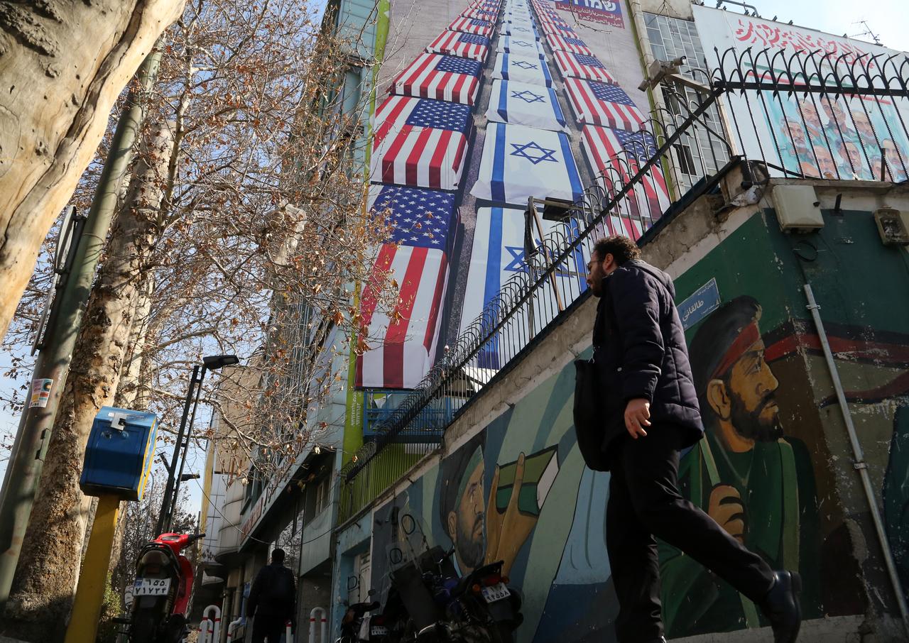 A man walks past an anti-American mural following a possible US intervention against Iran on January 28, 2026, in Tehran, Iran. (AA Photo)