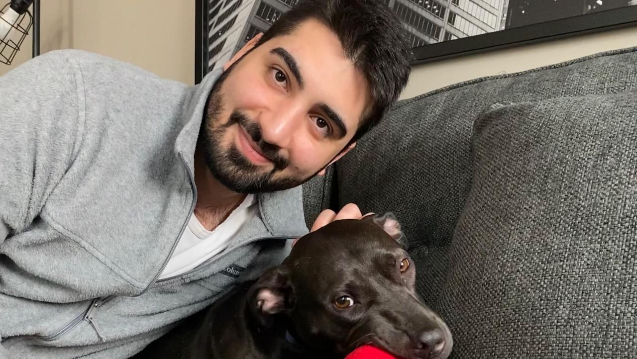 This image shows Doğukan Günaydın, a Turkish national and former MBA student at the University of Minnesota, posing with his dog. (Photo via GoFundMe)