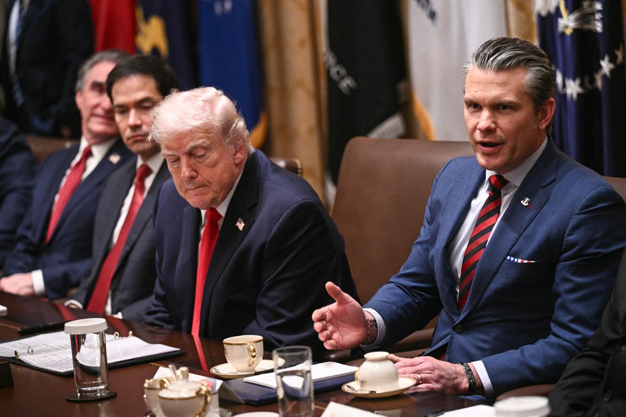 US President Donald Trump looks on as Secretary of Defense Pete Hegseth (R) speaks during a cabinet meeting in the Cabinet Room of the White House in Washington, DC, on January 29, 2026. (AFP Photo)