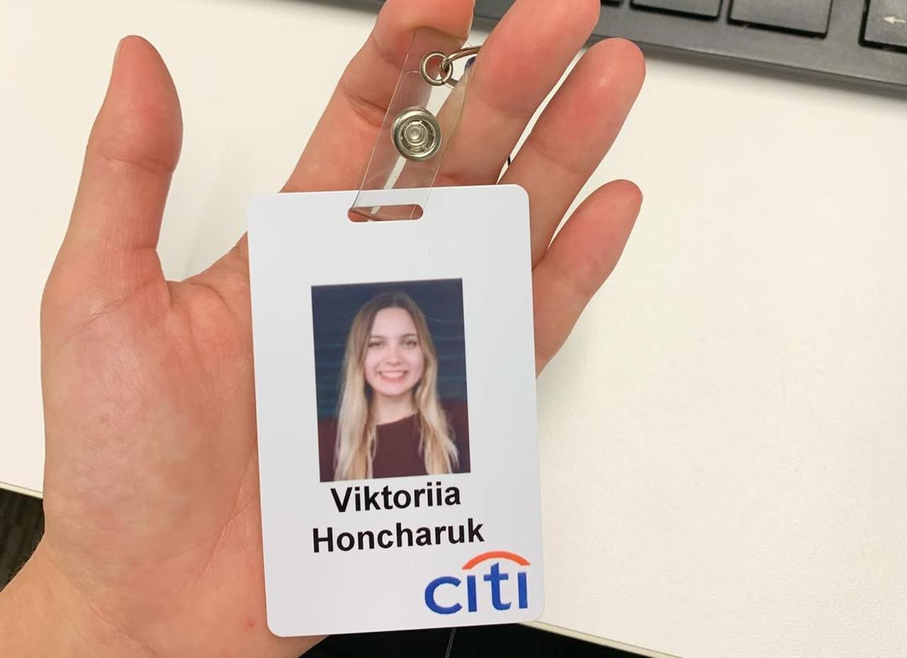 An employee identification badge bearing the name Viktoriia Honcharuk, photographed during her time working in the US financial sector before returning to Ukraine. (Photo via Instagram/victoria__honcharuk)