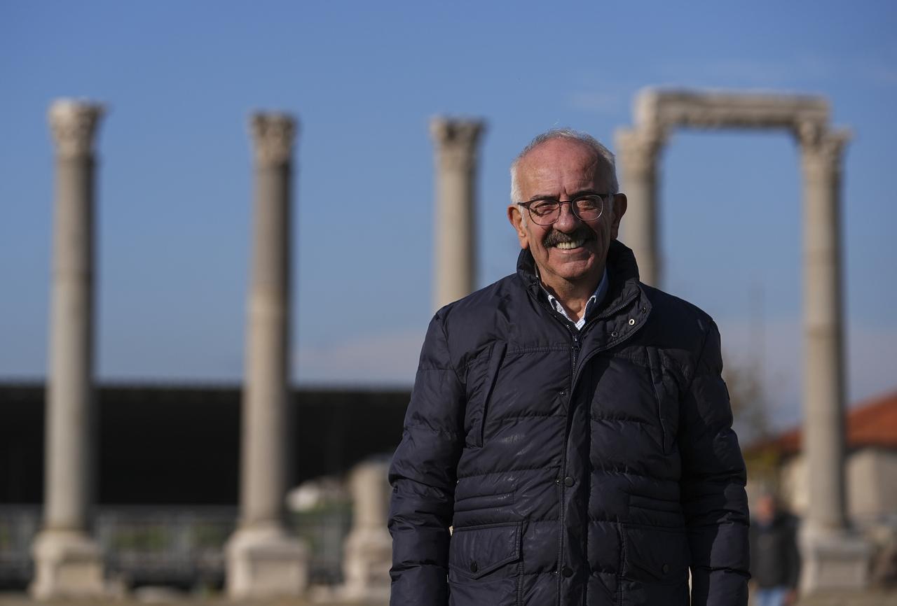 Excavation director Professor Akin Ersoy poses at the Smyrna ancient city, where a rare mosaic room with protective symbols has recently been uncovered. (AA Photo)