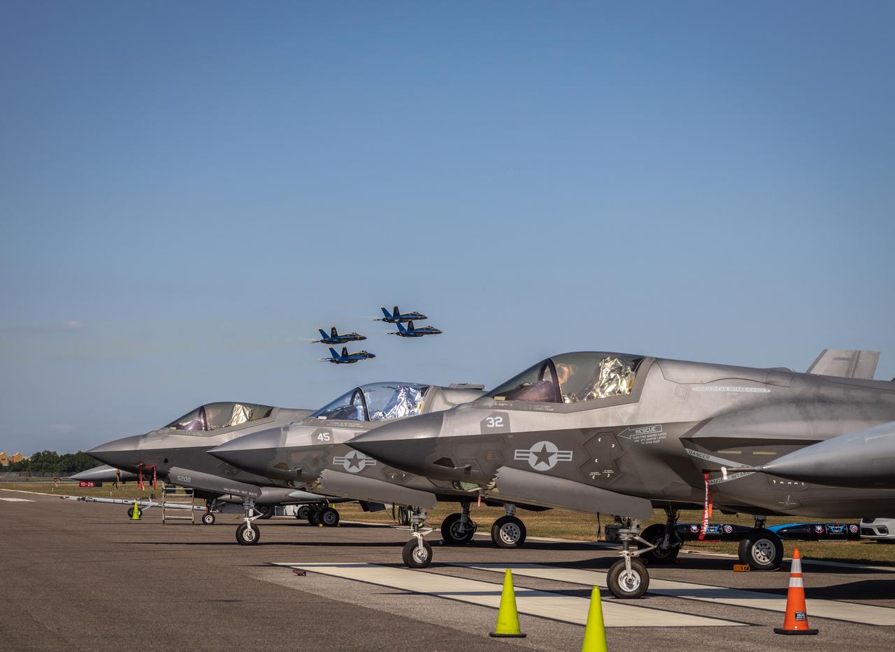 F-35 fighter jets and Blue Angels fly in formation at an unspecified location and time. (Adobe Stock Photo)