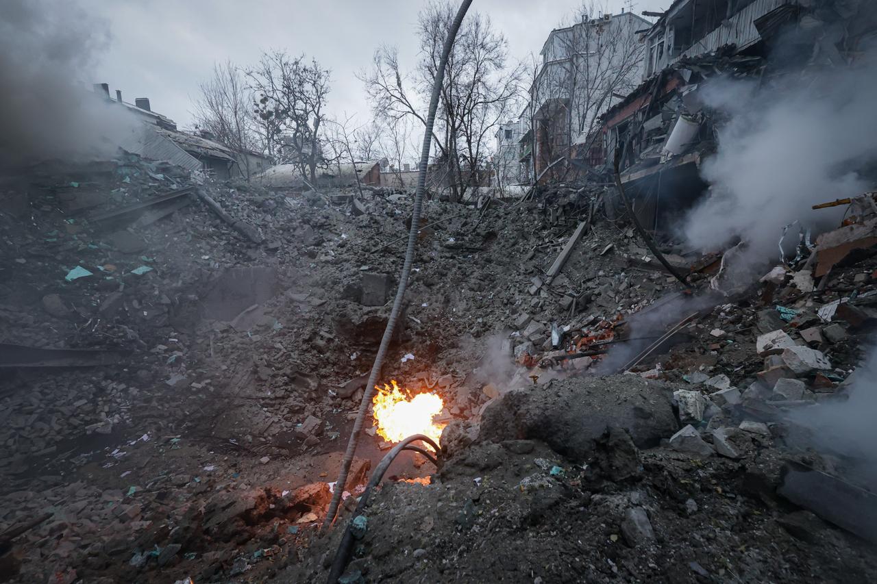 Ukrainian rescuers work at the scene after two Russian missiles hit the center of Kharkiv, Ukraine, January 2, 2026. (AA Photo)