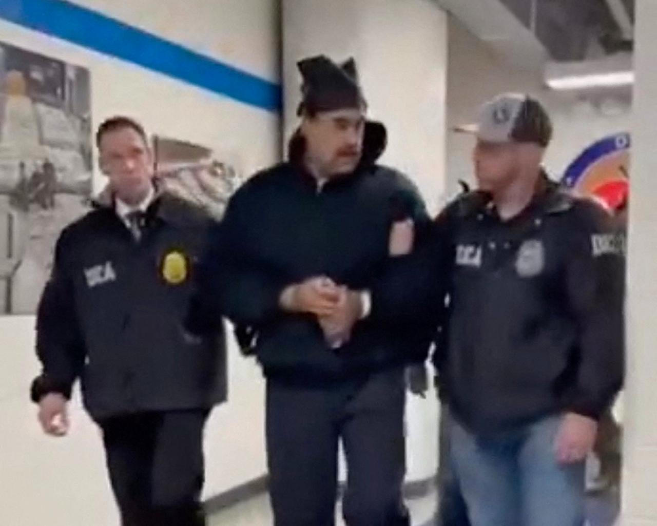This screengrab taken from the X account of Rapid Response 47, the official White House rapid response account, shows Venezuelan President Nicolas Maduro (C) escorted by DEA agents inside the headquarters of the US Drug Enforcement Administration (DEA) in lower Manhattan, New York on Jan. 3, 2026. (AFP Photo)