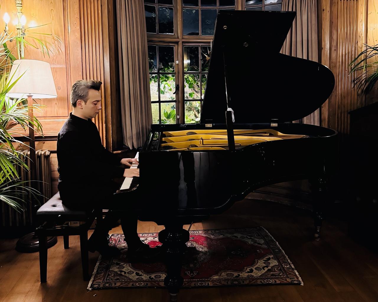 Pianist and composer Dengin Ceyhan performs on stage during a concert of his Echoes of Anatolia international tour, which carried Anatolian musical heritage to audiences in nine countries across three continents. (AA Photo)