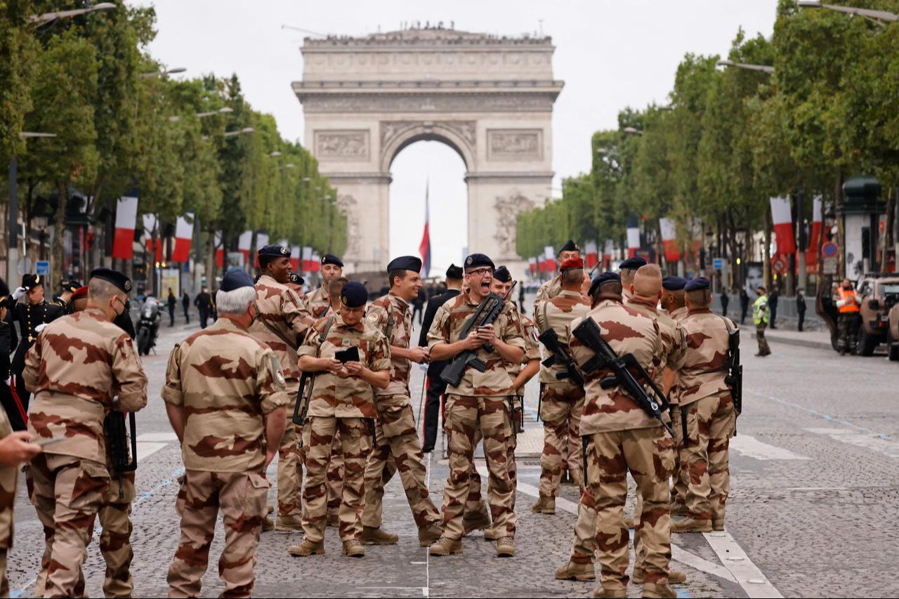 French Army soldiers from the 'Operation Barkhane' get ready as preparations are made for the annual Bastille Day military parade on the Champs-Elysees avenue in Paris, July 14, 2021. (AFP Photo)