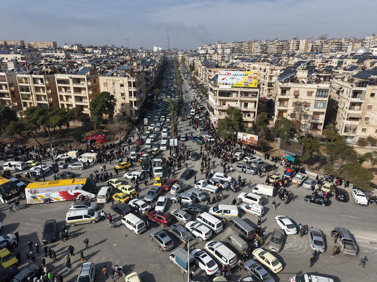 Civil defense teams affiliated with Syria's Ministry of Emergency and Disaster Management evacuate families trapped in their homes in various neighborhoods to shelter centers in Aleppo, Syria on January 7, 2026. (AA Photo)