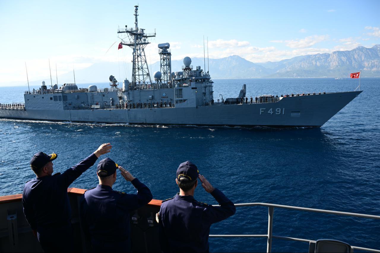 Turkish Naval Forces Commander Admiral Ercument Tatlioglu salutes TCG Giresun (F-491) while observing the activities held during an exercise in Antalya, Türkiye, Dec. 2, 2025. (AA Photo)