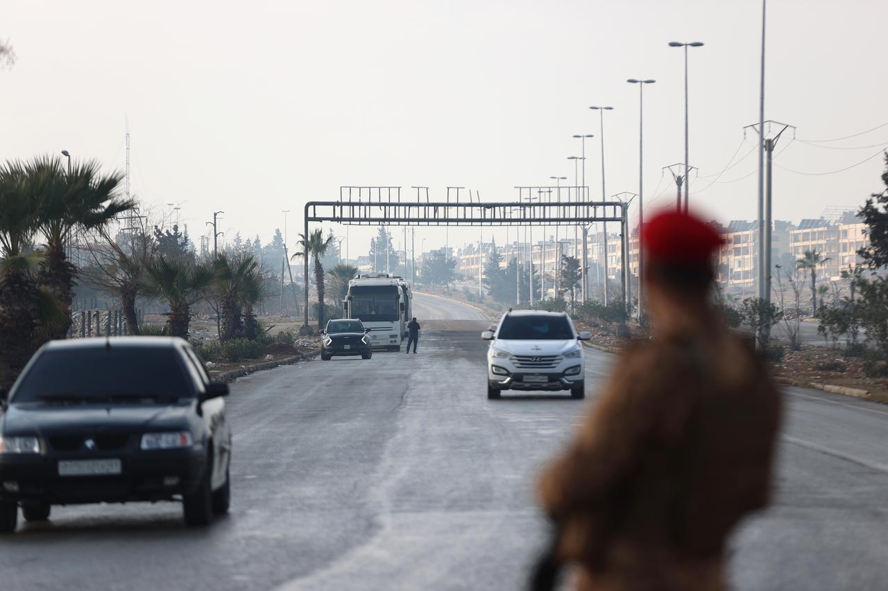 Buses prepared for the “evacuation” of members of the terrorist organization PKK/YPG, operating under the name SDF, arrive at Layramoun Junction in the Ashrafieh neighborhood, Aleppo, Jan. 9, 2026. (AA Photo)