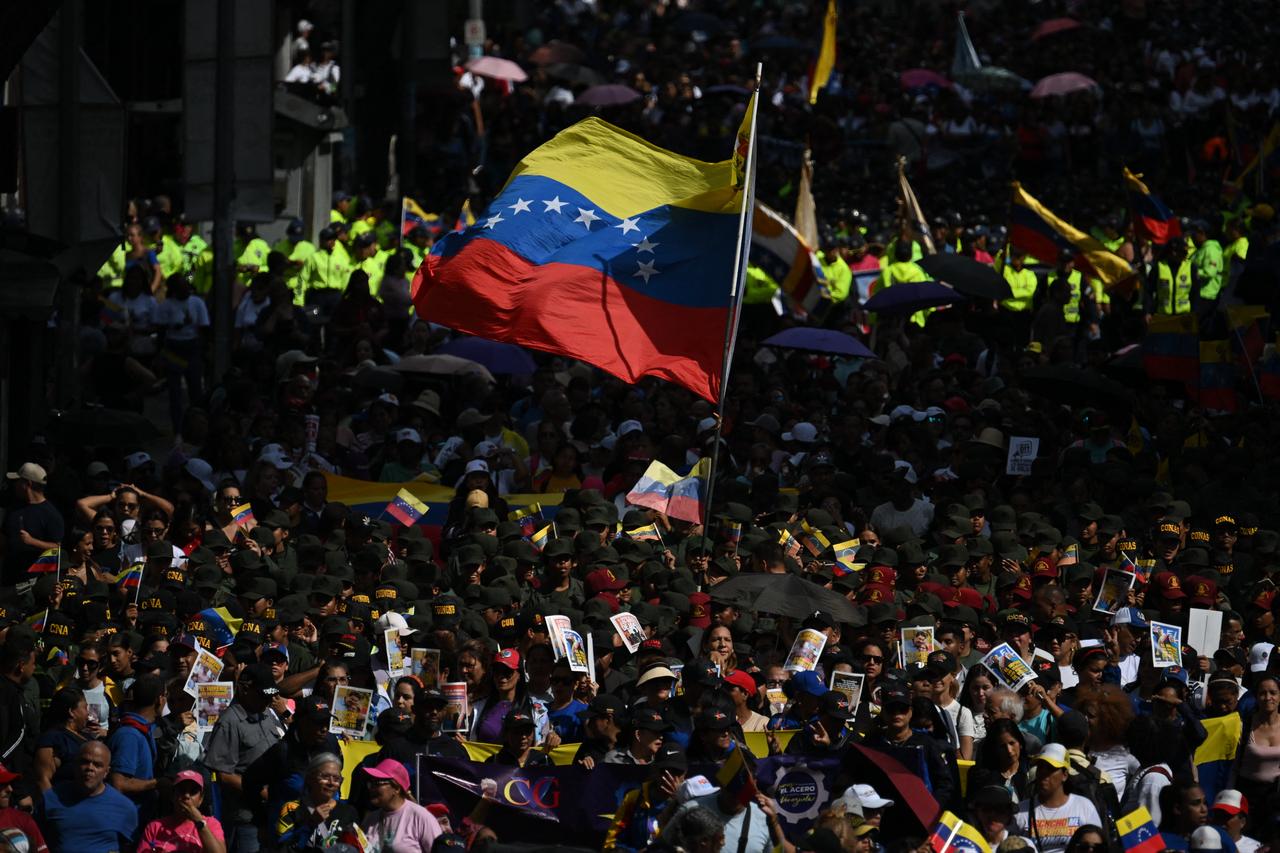 People attend a rally in support of Venezuela's ousted President Nicolas Maduro and his wife Cilia Flores in Caracas on January 6, 2026. (AFP Photo)