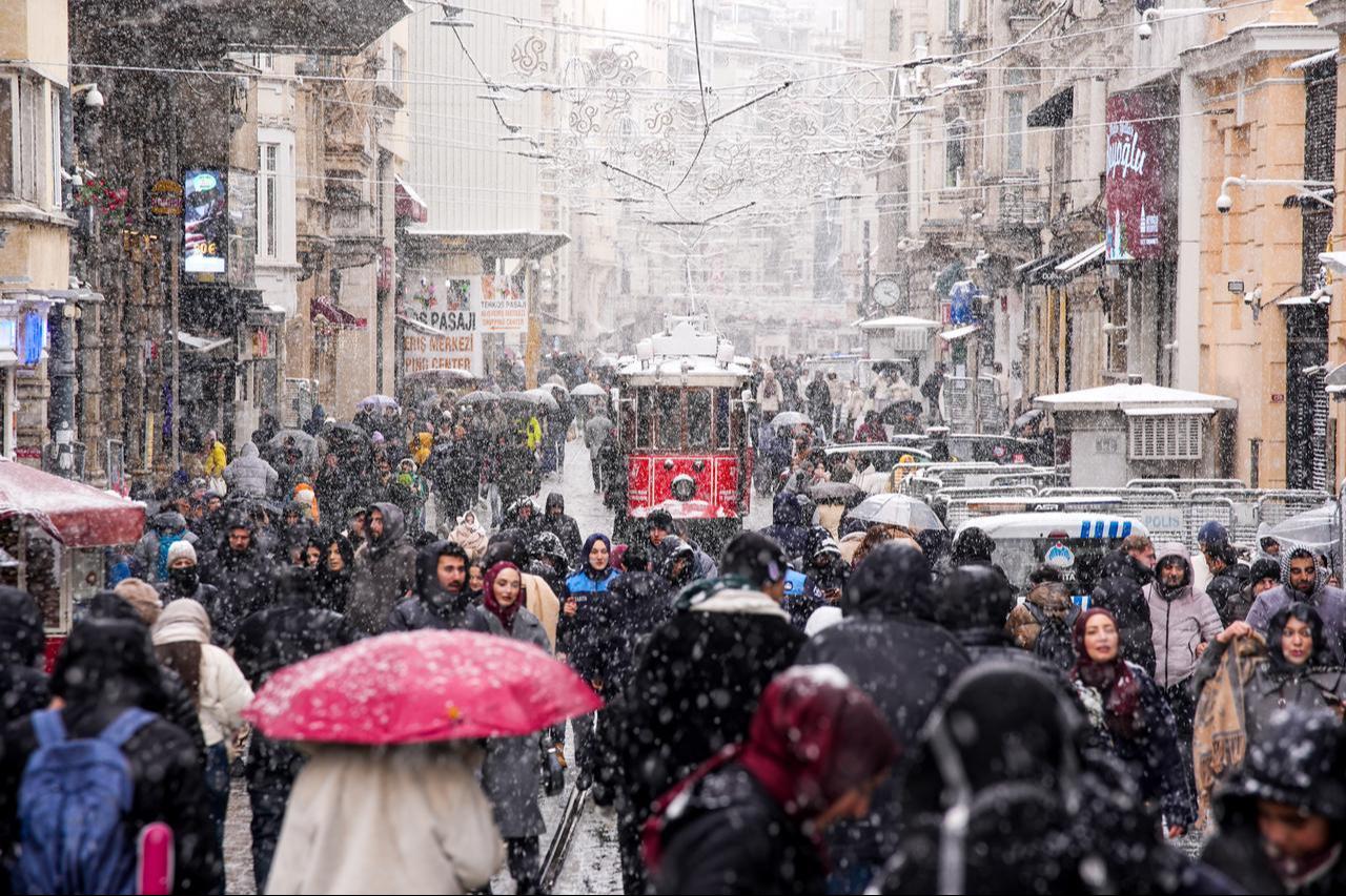 Snowfall continues to affect parts of Istanbul, Türkiye, as a tram travels through a snow-covered street on the first day of the new year, January 1, 2026. (AA Photo)