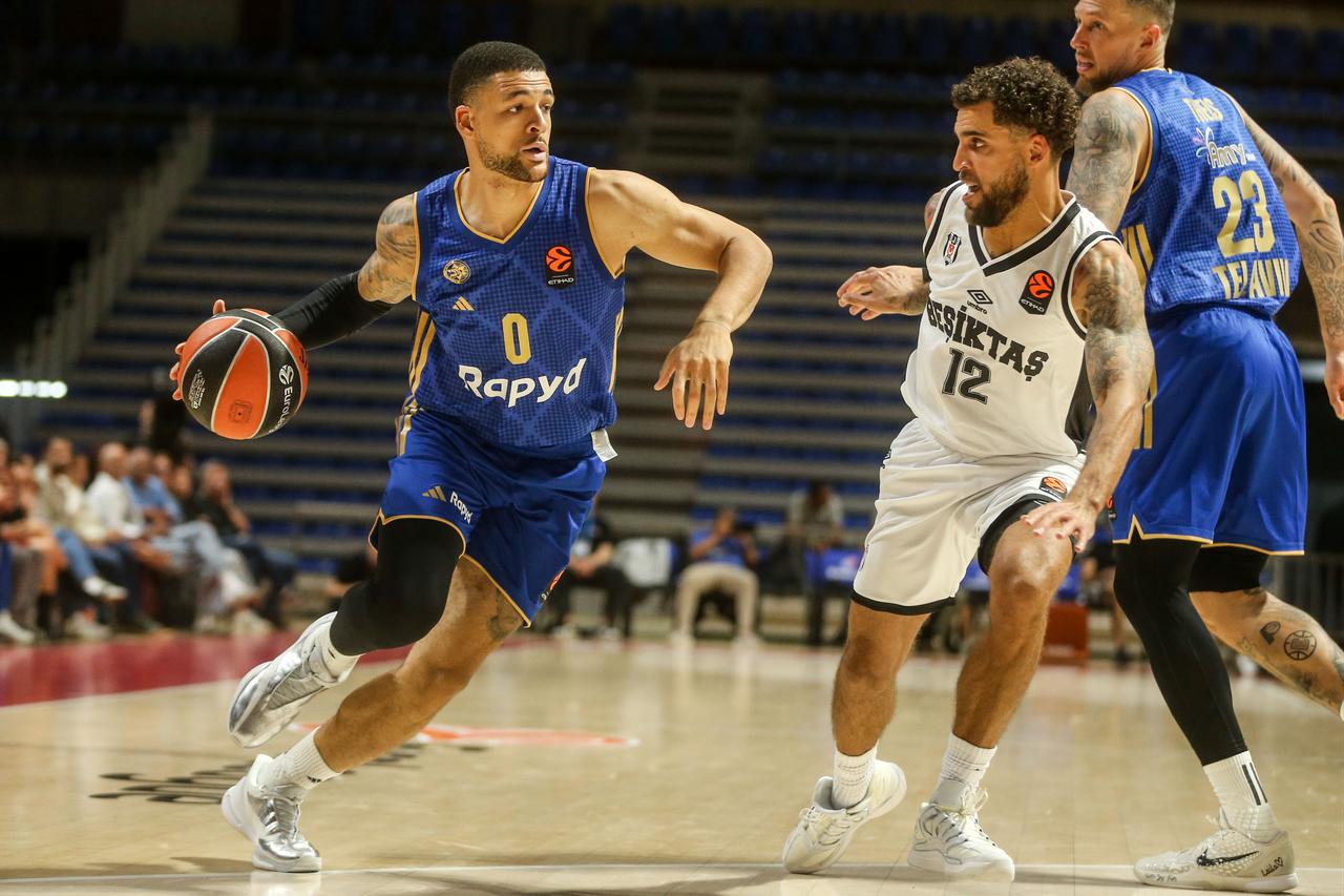 Wilbekin (12) of Besiktas in action against Lundberg (0) of Maccabi Tel Aviv during the 2026/2027 EuroLeague Round 2 match between Maccabi Tel Aviv and Besiktas at Aleksandar Nikolic Hall in Belgrade, Serbia, on September 30, 2026. (AA Photo)