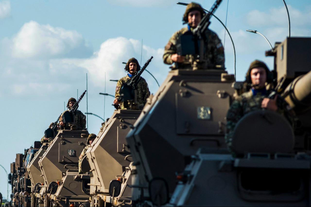 Soldiers stand on top of armored vehicles during a military parade in Nicosia on October 1, 2025. (AFP Photo)