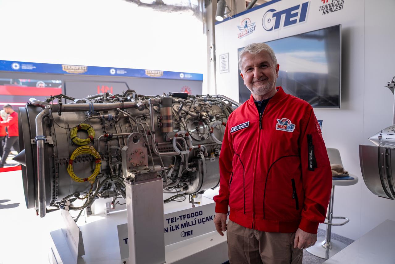 The photo shows TEI's General Manager Mahmut Faruk Aksit with the TF6000 turbofan engine at the Teknofest festival in Sanliurfa, Türkiye, Oct. 1, 2026. (AA Photo)