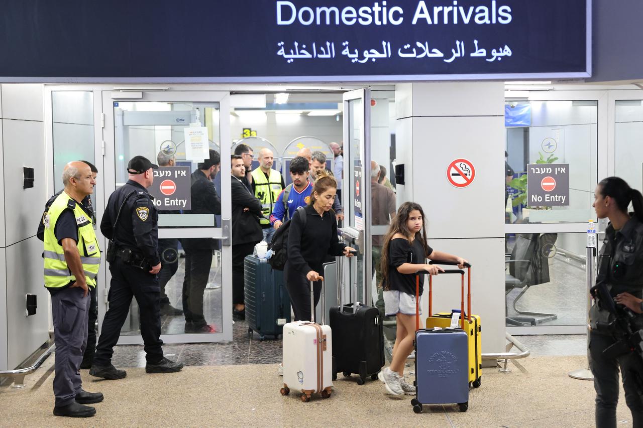 Passengers from an earlier diverted flydubai flight are seen after landing at Israel's Ben Gurion Airport in Lod on September 30, 2026. (AFP Photo)