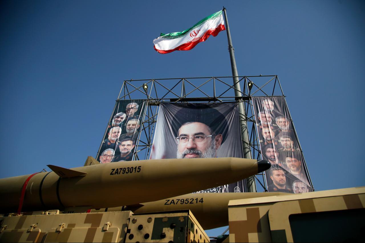 An Iranian flag is seen as ballistic missiles, air defense systems and unmanned aerial vehicles are displayed at Baharestan Square as part of Iran's "Sacred Defense Week" in Tehran, Iran, Sept. 29, 2026. (AA Photo)