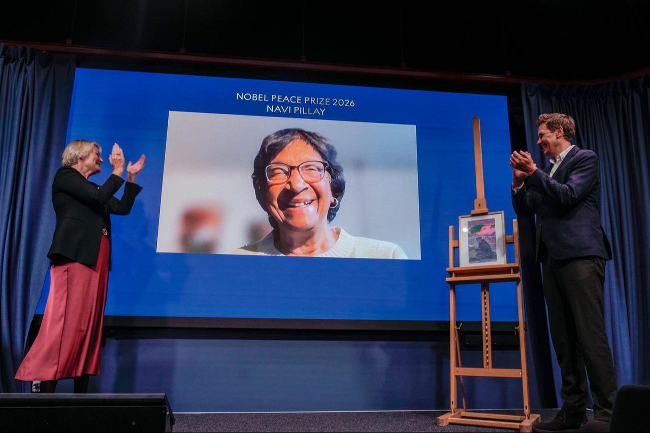 The Director of the Nobel Peace Center Kjersti Flogstad (L) and the Head of the Norwegian Nobel Committee, Jorgen Watne Frydnes react with the 2026 Nobel Peace Prize laureate Navanethem 'Navi' Pillay seen on a screen via video link at the Nobel Peace Center in Oslo on October 10, 2026. (AFP Photo)