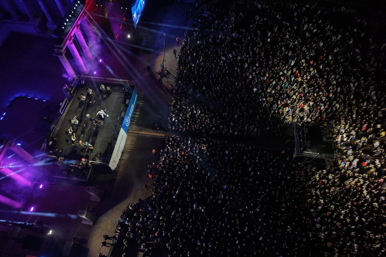 An aerial view of a large crowd gathered at night for Goran Bregovic's concert at the ancient site of Sardis. (AA Photo)
