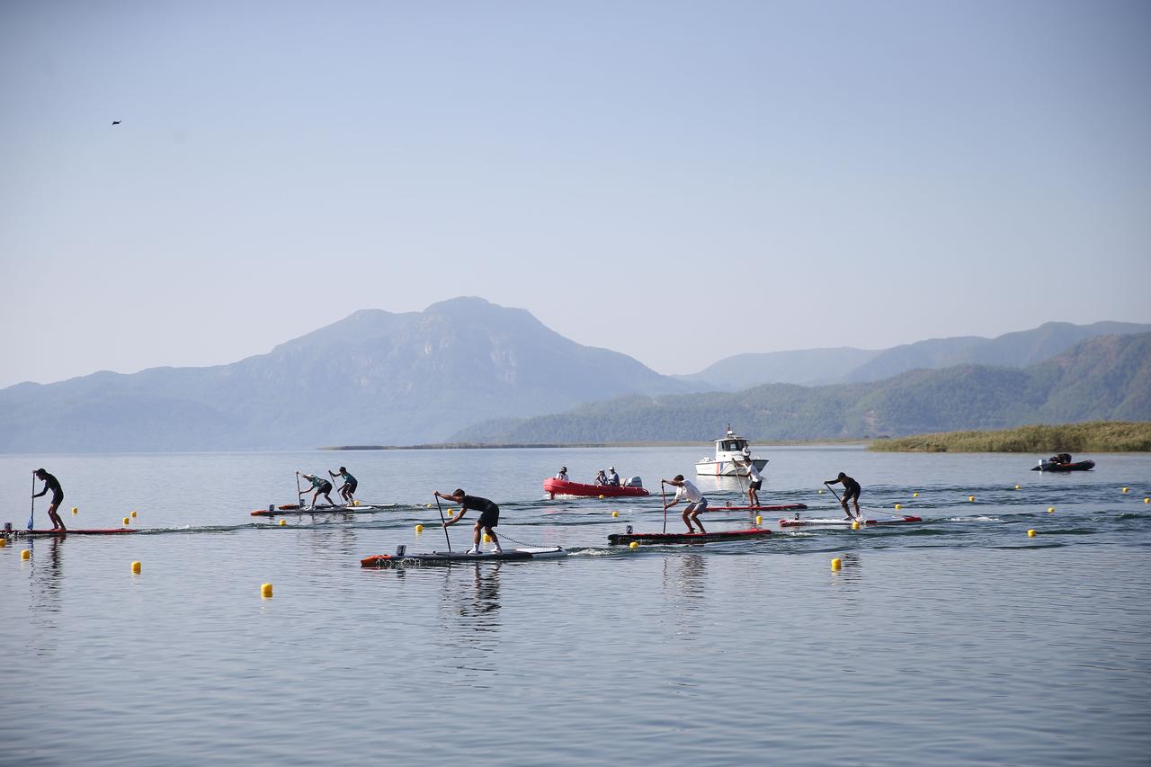 Competitors race on stand-up paddleboards during the SUP Turkish Canoe Championship held in Koycegiz. (AA Photo)