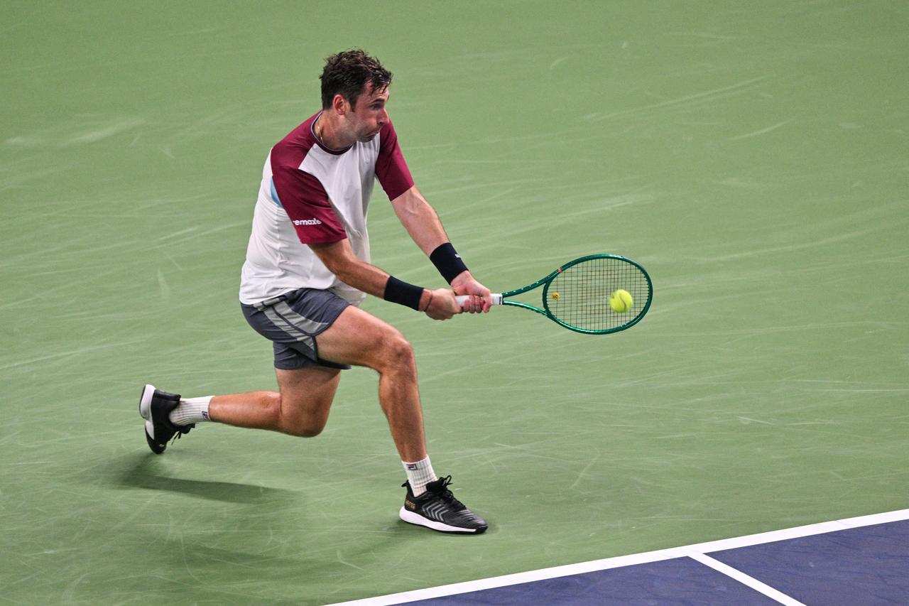 Halys hits a return to Zverev during their men's singles match at the Shanghai Masters tennis tournament in Shanghai on Oct. 11, 2026. (AFP Photo)