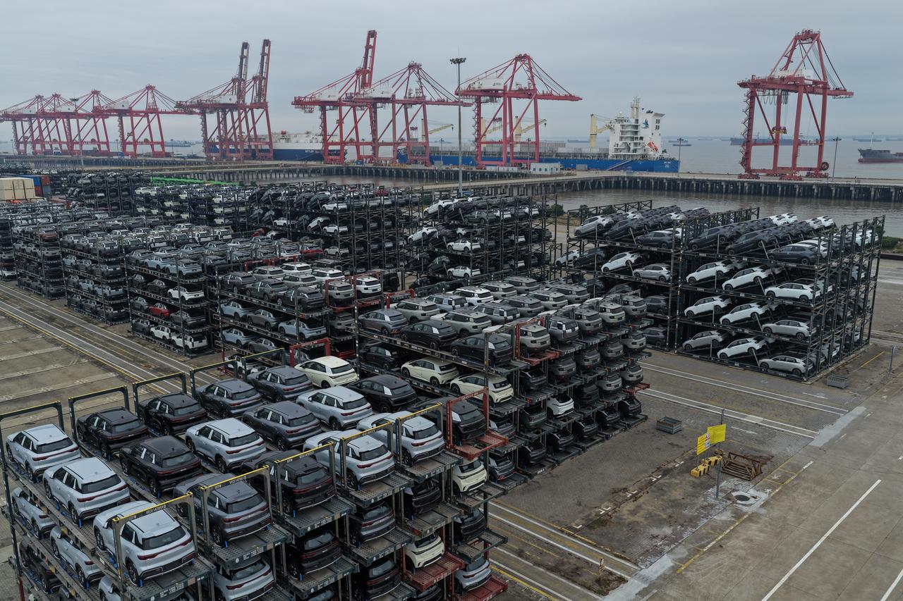 Chinese-made cars including BYD, BAIC, Jetour, Lynk & Co, and MG are seen in specialised vehicle racks in preparation for loading onto ships for export, at the Taicang Port area of Suzhou Port, in China’s eastern Jiangsu province, October 12, 2026. (AFP Photo)