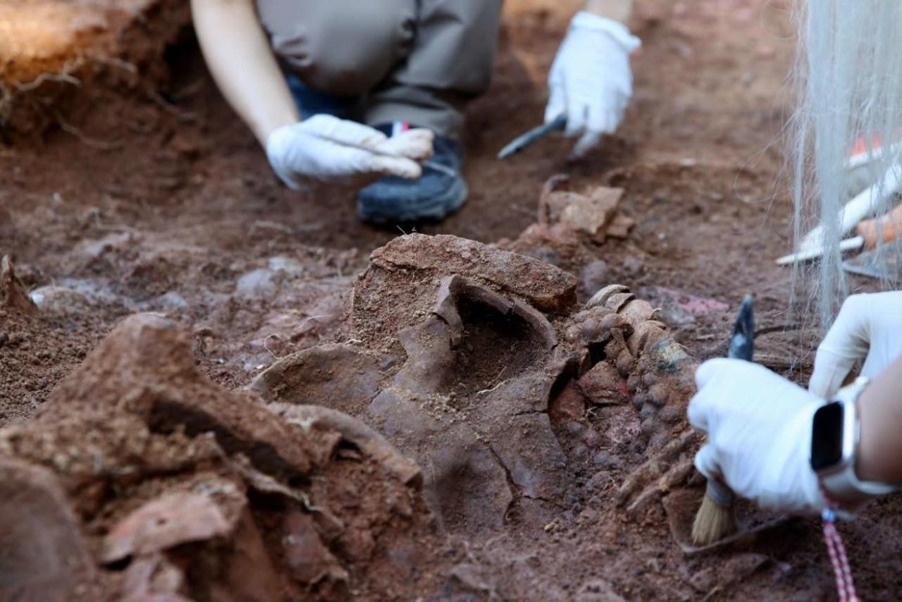 Archaeologists carefully uncover pottery fragments and other ancient remains at Kurul Castle, where recent excavations have revealed new areas associated with the cult of Dionysos. (IHA Photo)