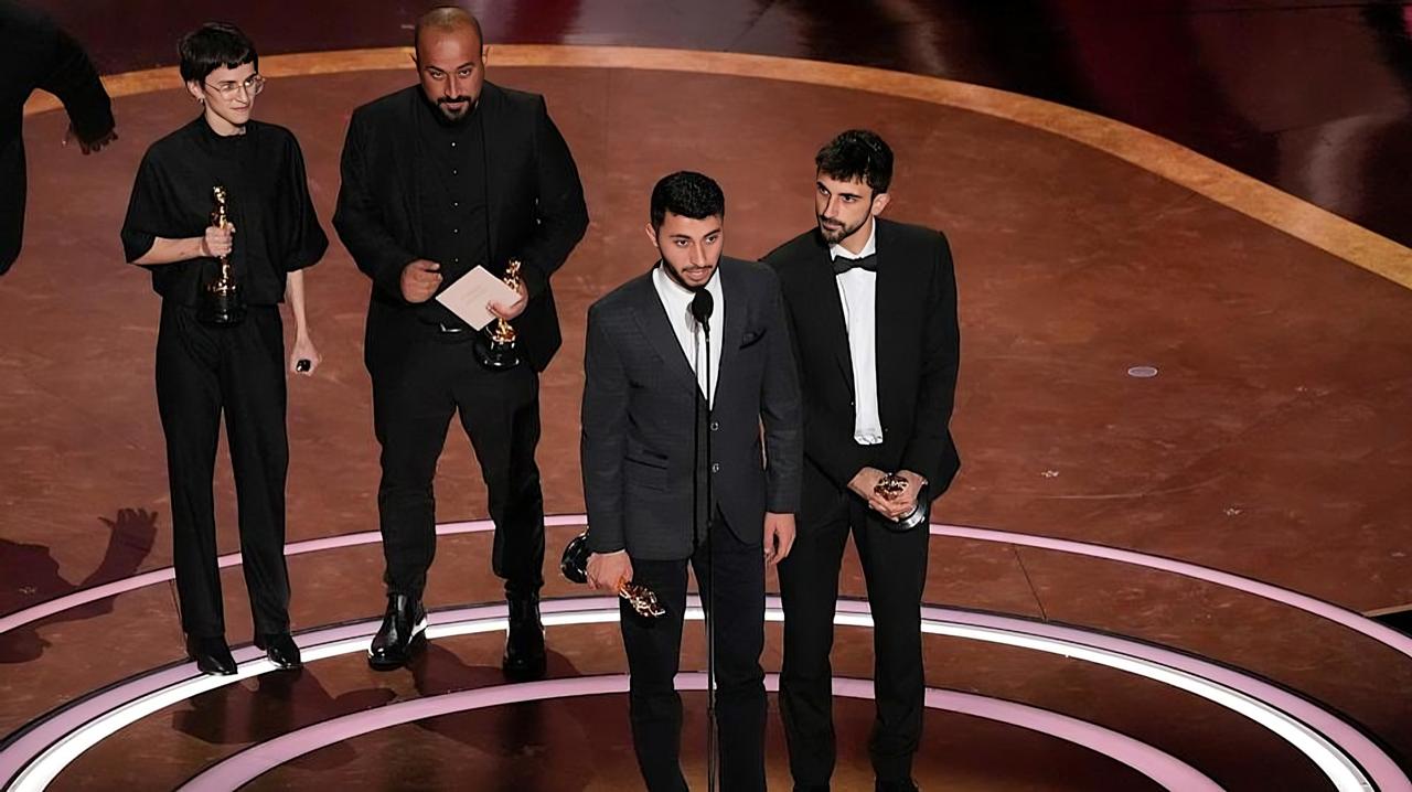 (L-R) Rachel Szor, Hamdan Ballal, Basel Adra and Yuval Abraham accept the Documentary Feature Film award "No Other Land" onstage during the 97th Annual Oscars at Dolby Theatre on March 02, 2025 in Hollywood, California. (AFP Photo)