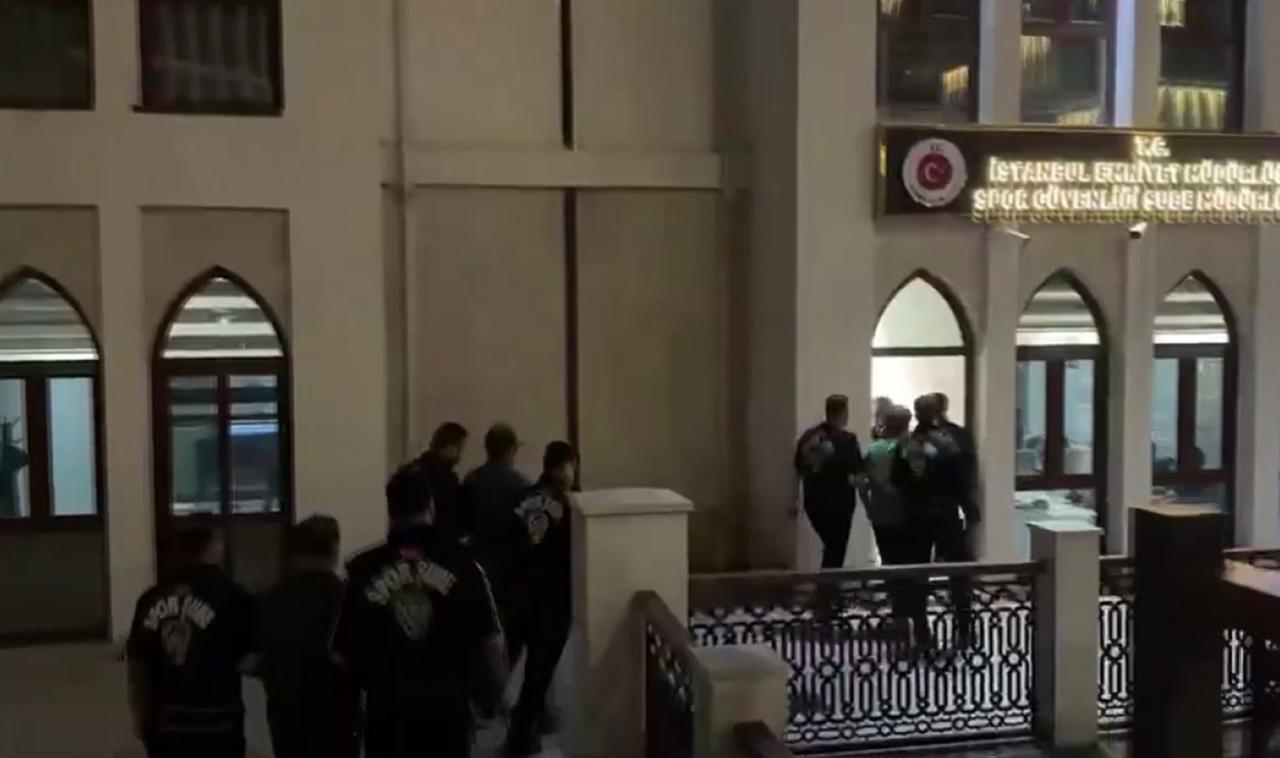 Police officers escorting suspects to the Istanbul Police Department’s Sports Security Branch in connection with an investigation into alleged black-market ticket sales in Istanbul, Türkiye, Oct. 12, 2026. (IHA Photo)