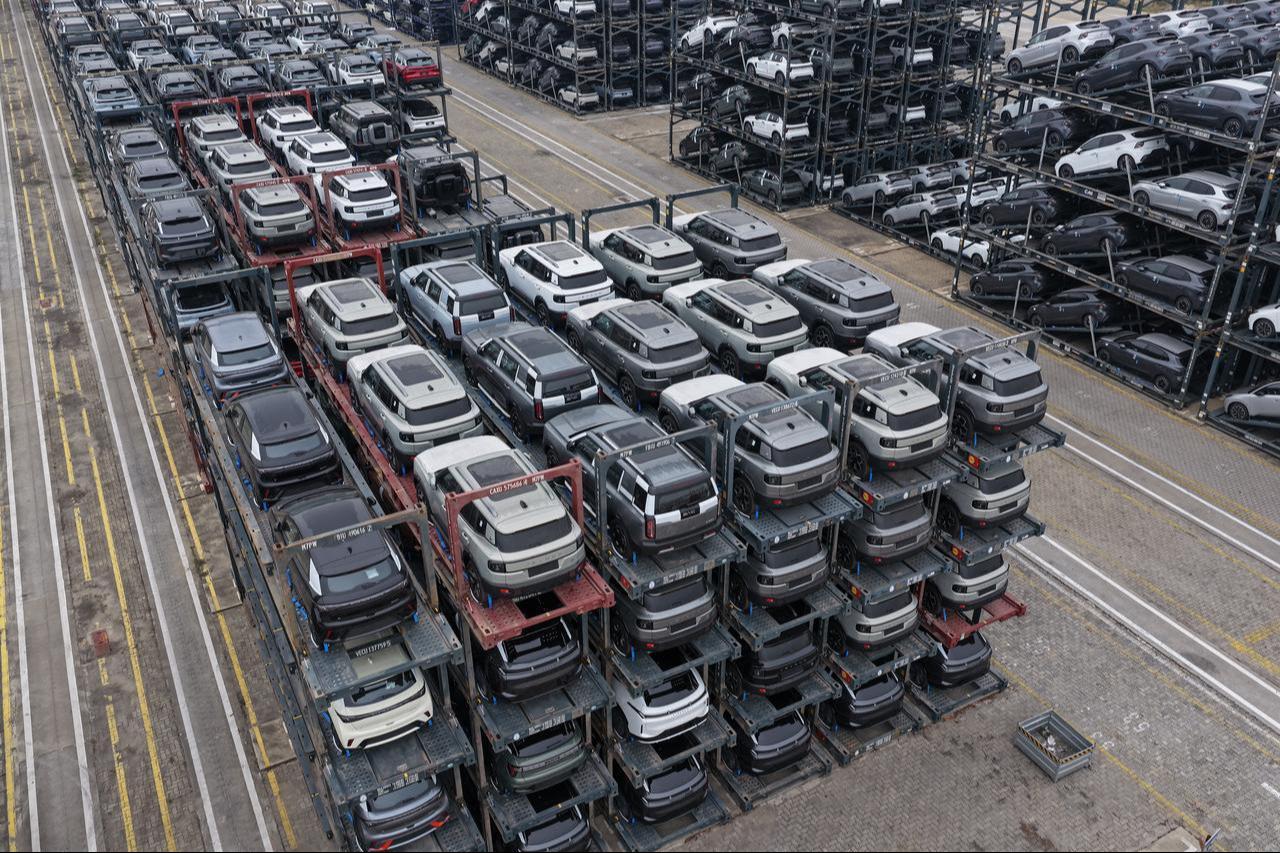 Chinese-made cars, including BYD, BAIC, Jetour, Lynk & Co, and MG, are seen in specialized vehicle racks in preparation for loading onto ships for export at the Taicang Port area of Suzhou Port, in China’s eastern Jiangsu province, October 12, 2026. (AFP Photo)