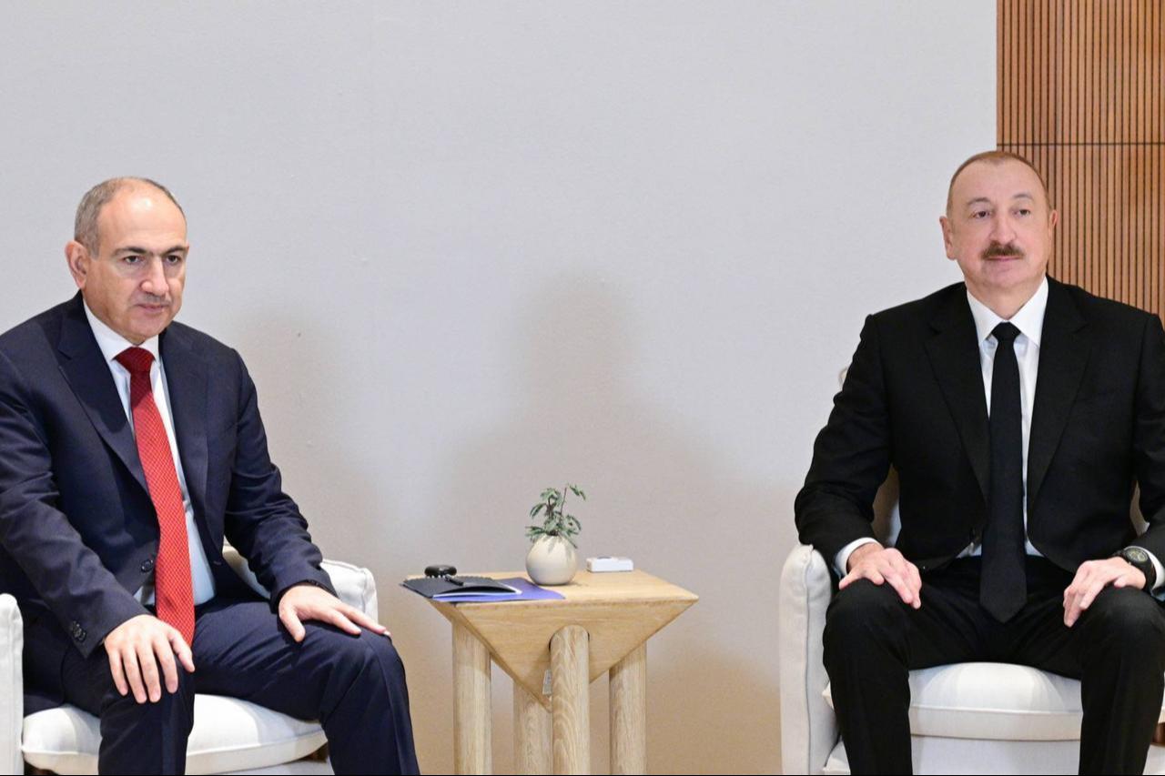 Armenian Prime Minister Nikol Pashinyan (L) and Azerbaijani President Ilham Aliyev (R) meet in Abu Dhabi, UAE, Feb. 4, 2026. (Azerbaijan PM Office HO / AA Photo)