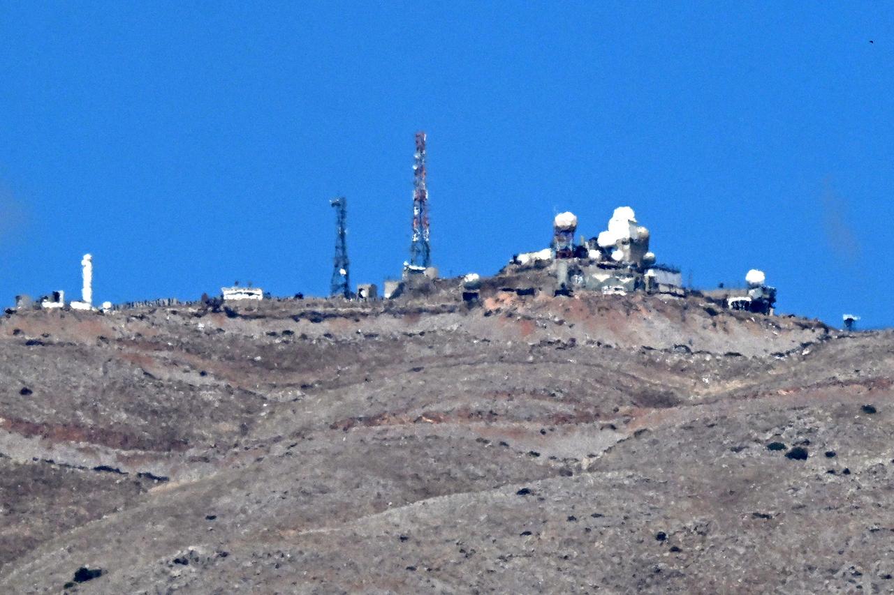 An Israeli military facility is pictured from the village of Jbata al-Khashab in Quneitra in southwestern Syria near the Israeli-annexed Golan Heights on October 7, 2026. (AFP Photo)