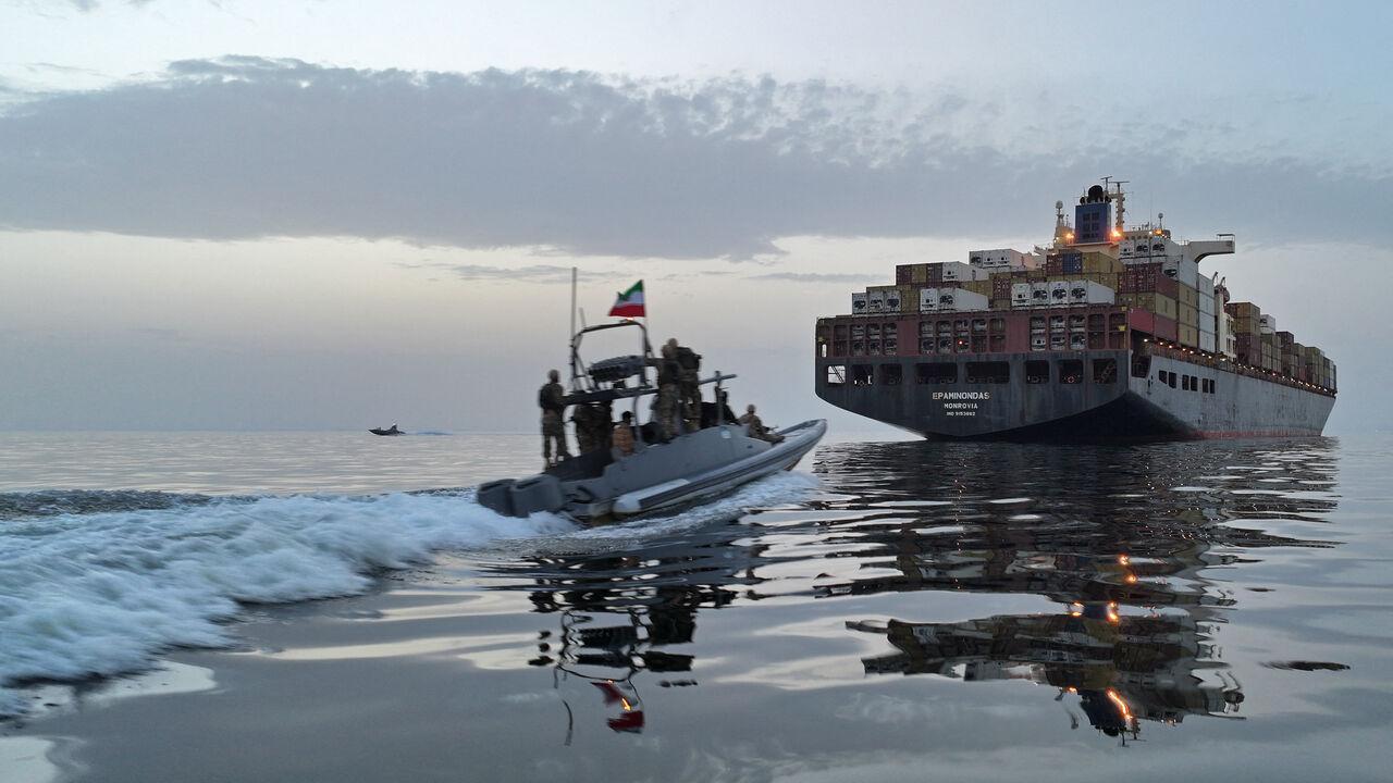 This photo obtained by AFP from the Iranian news agency Tasnim shows an Islamic Revolutionary Guard Corps (IRGC) boat allegedly taking part in an operation to seize ships attempting to cross the Strait of Hormuz, on April 21, 2026. (AFP Photo)