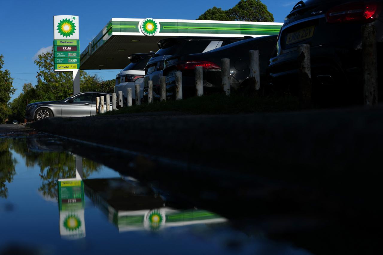 A BP petrol station is reflected in a puddle in Cranbrook, south east England on October 13, 2026. (AFP Photo)
