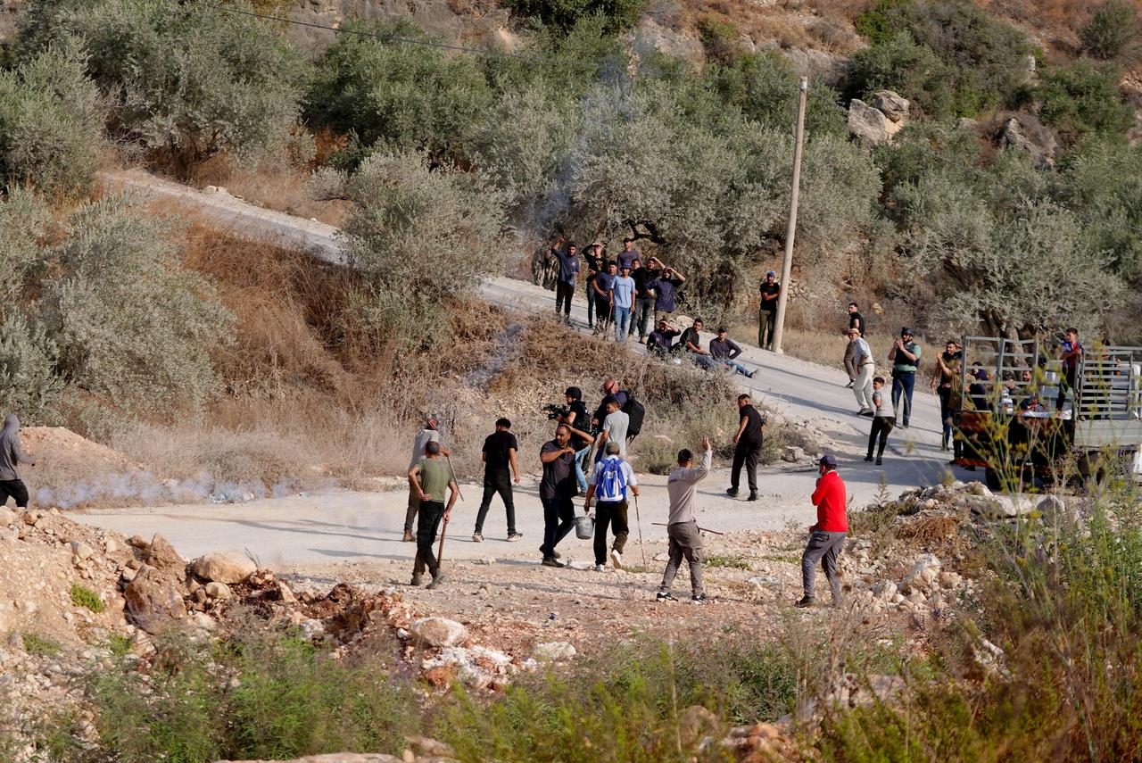 Israeli settlers attack Palestinians harvesting olives in the village of Deir Abu Mashal, northwest of Ramallah in the West Bank, Palestine, on October 10, 2026. (AA Photo)