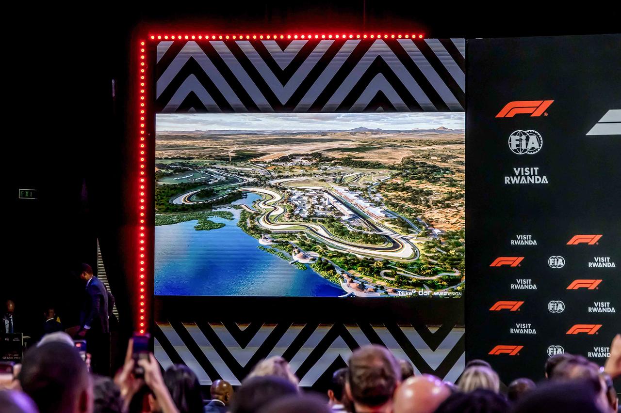 Attendees follow a presentation as a render of the proposed Formula 1 circuit in Rwanda is displayed on giant screens during the announcement of the Formula 1 African Grand Prix at BK Arena in Kigali on October 13, 2026. (AFP Photo)