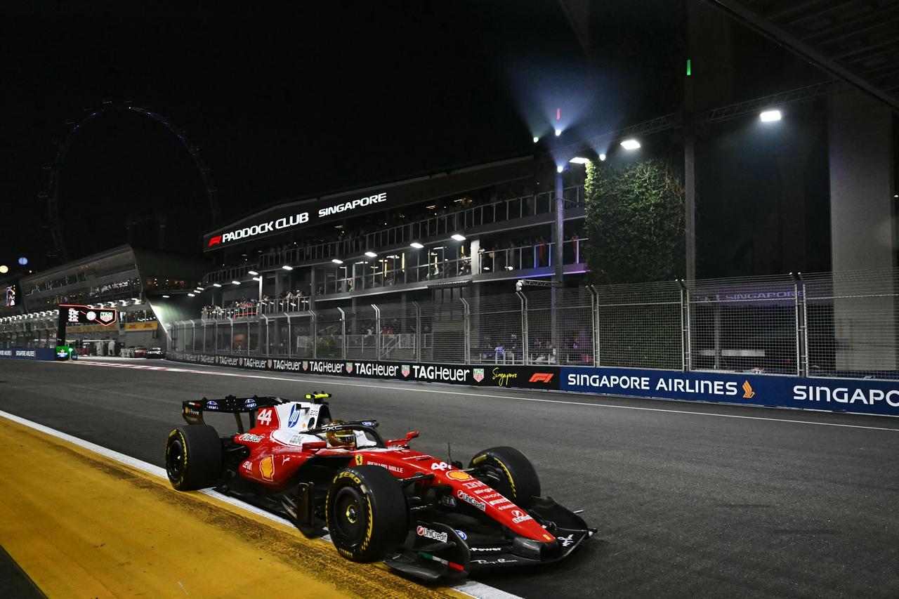 Ferrari's British driver Lewis Hamilton drives during the Formula One Singapore Grand Prix at the Marina Bay Street Circuit in Singapore on October 11, 2026. (AFP Photo)