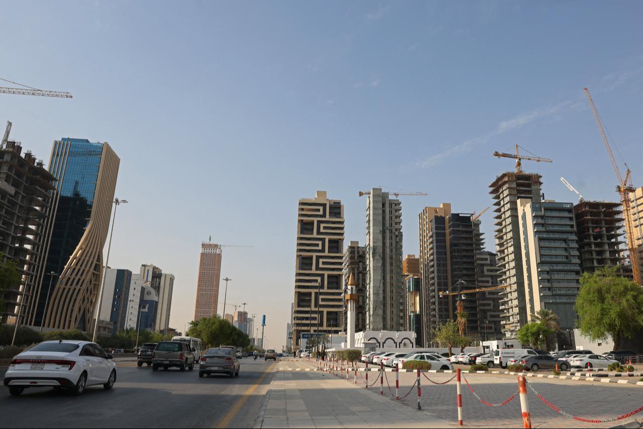 Cars drive past city skyscrapers in Riyadh, October 11, 2026. (AFP Photo)