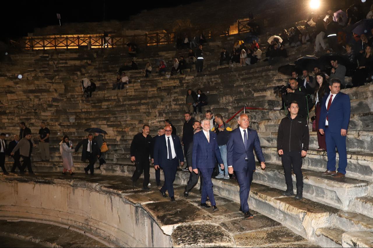 Turkish Culture and Tourism Minister Mehmet Nuri Ersoy and Italian Culture Minister Alessandro Giuli walk through the ancient theater of Hierapolis following the 17th Italian Cultural Center Archaeology Symposium in Denizli, Türkiye, October 13, 2026. (AA Photo)