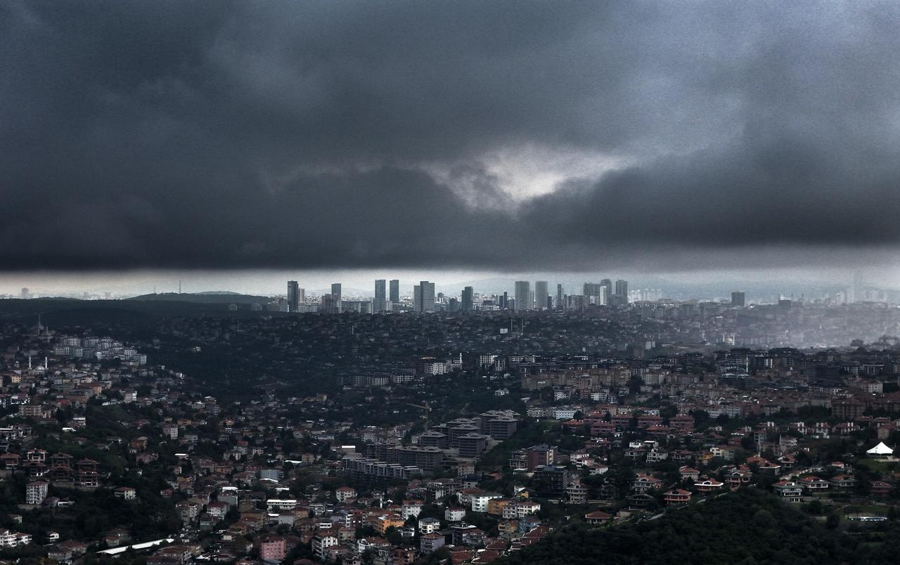 Thick, dark clouds blanket Istanbul's skyline as stormy weather approaches the city, Istanbul, Türkiye. (IHA Photo)