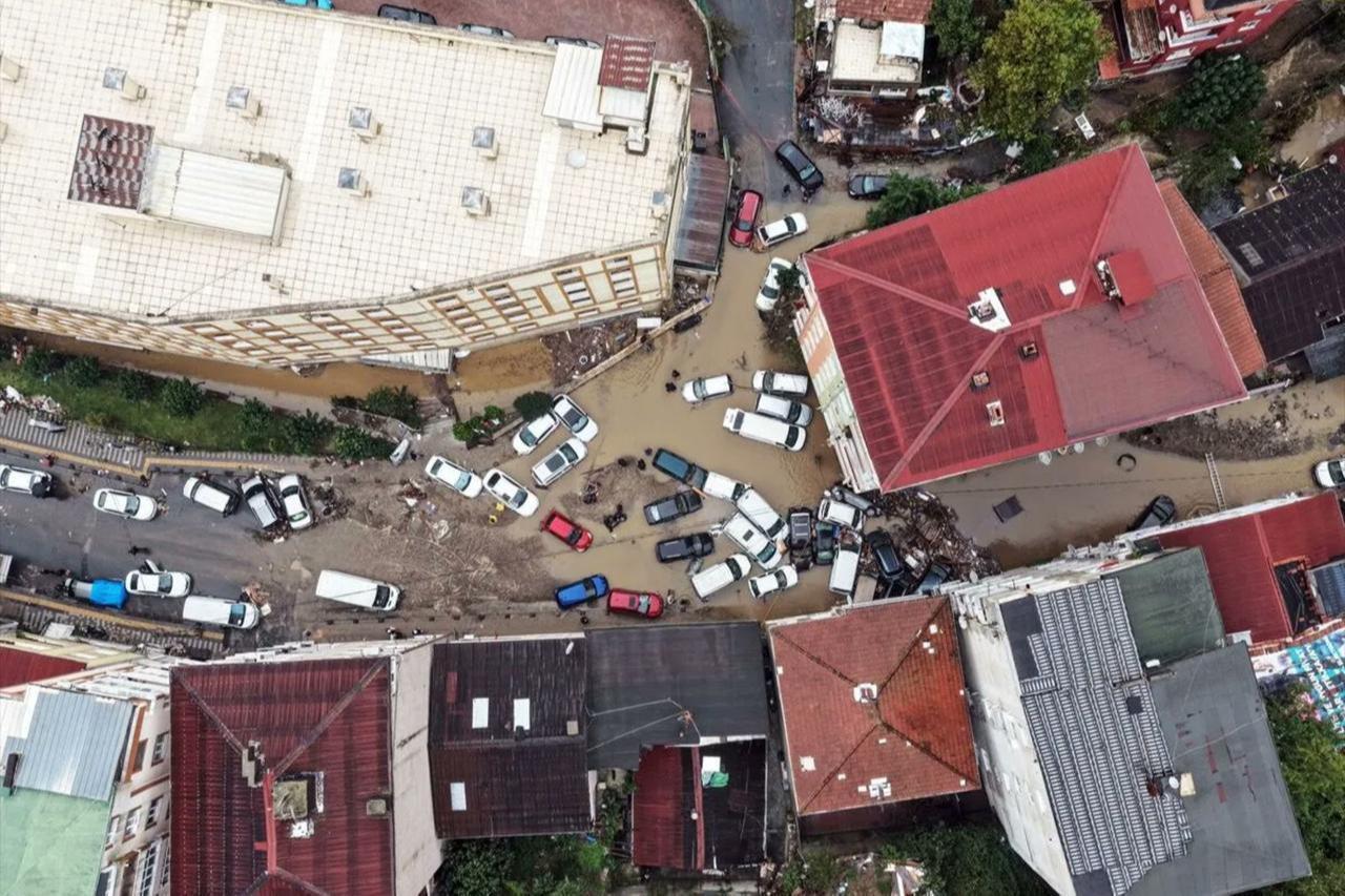 An aerial view shows floodwaters covering streets and vehicles stranded between buildings following heavy rainfall in Istanbul, Türkiye, October 15, 2026. (IHA Photo)
