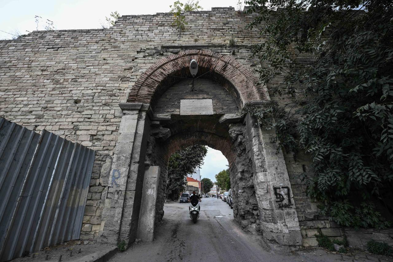 The historic Yedikule Gate, featuring a pointed brick arch and an Ottoman restoration inscription, stands along Istanbul's ancient land walls, Türkiye, October 14, 2026. (AA Photo)