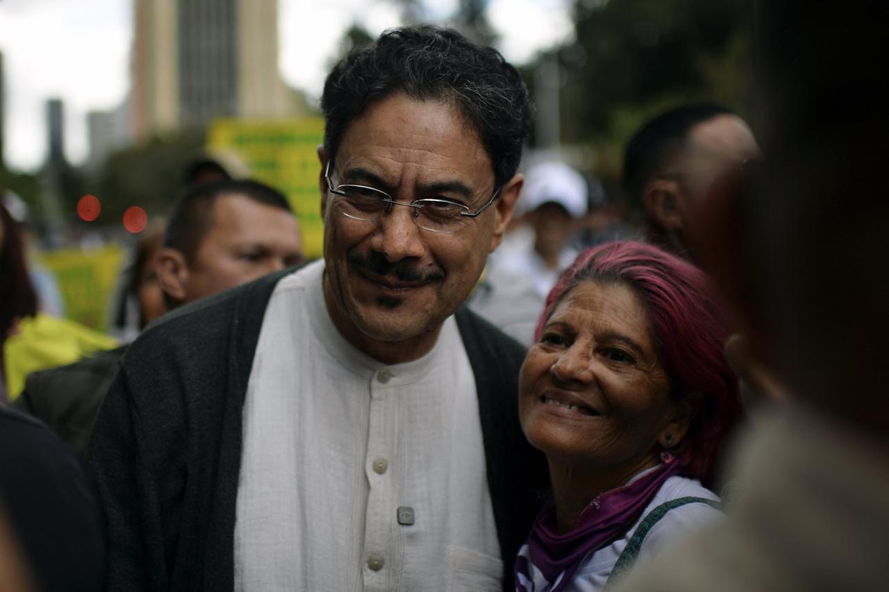 Colombia's former presidential candidate and current senator Ivan Cepeda (L) poses for a photograph with a supporter during a protest against the government of Colombian President Abelardo de la Espriella in Bogota on Oct. 14, 2026. (AFP Photo)