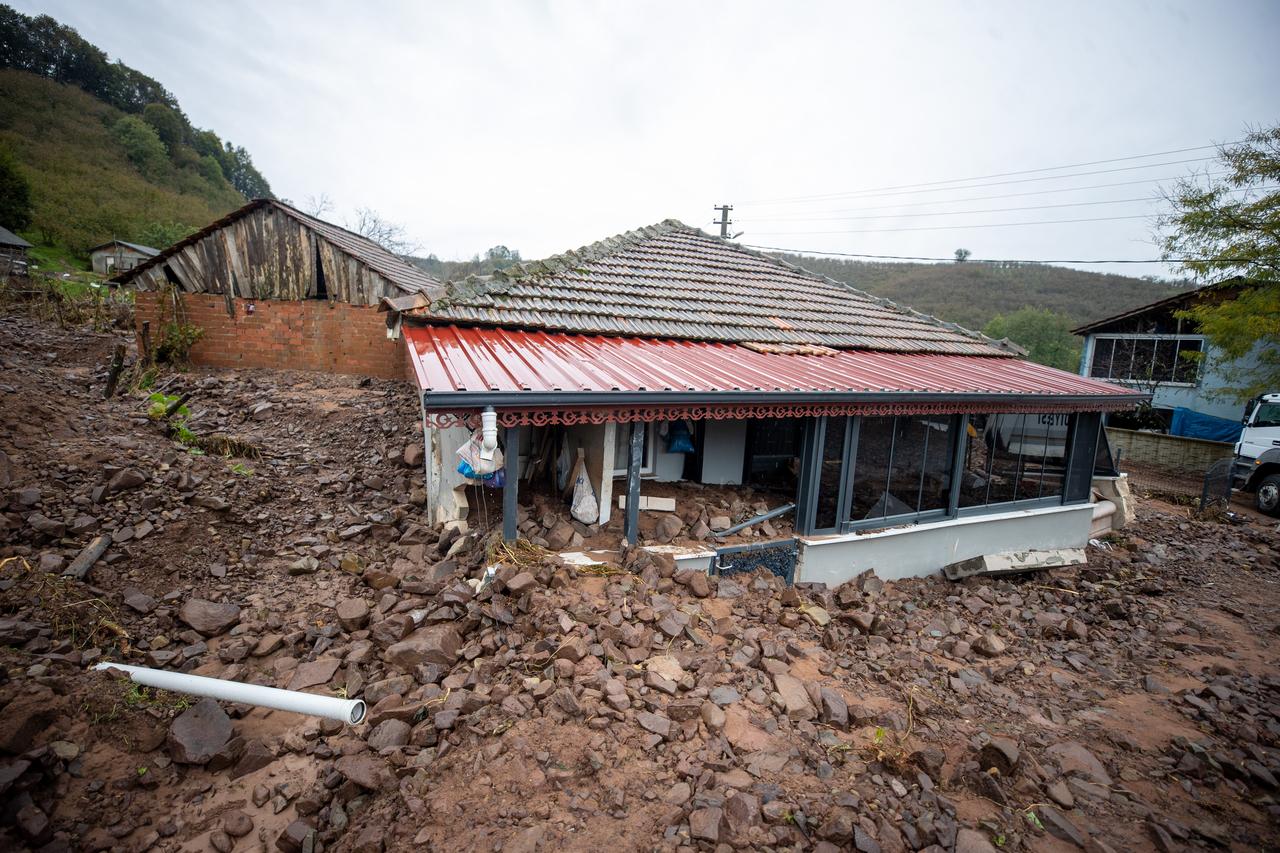 Homes are damaged by a landslide and mud and rock debris carried by floodwaters following heavy rainfall in Karasu district of Sakarya, Türkiye, on October 16, 2026. (AA Photo)
